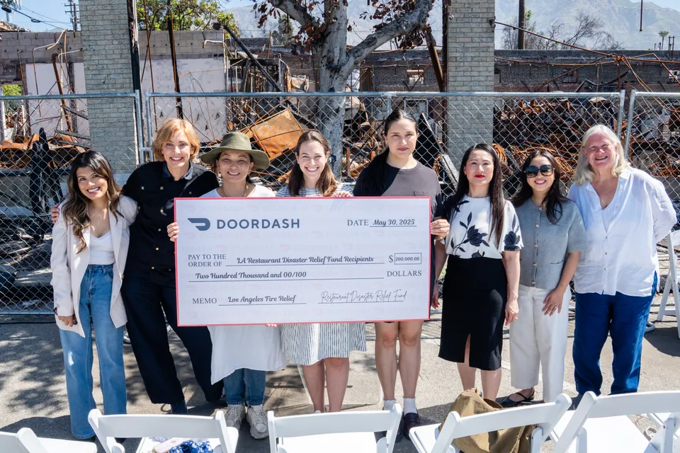 women holding jumbo sized check