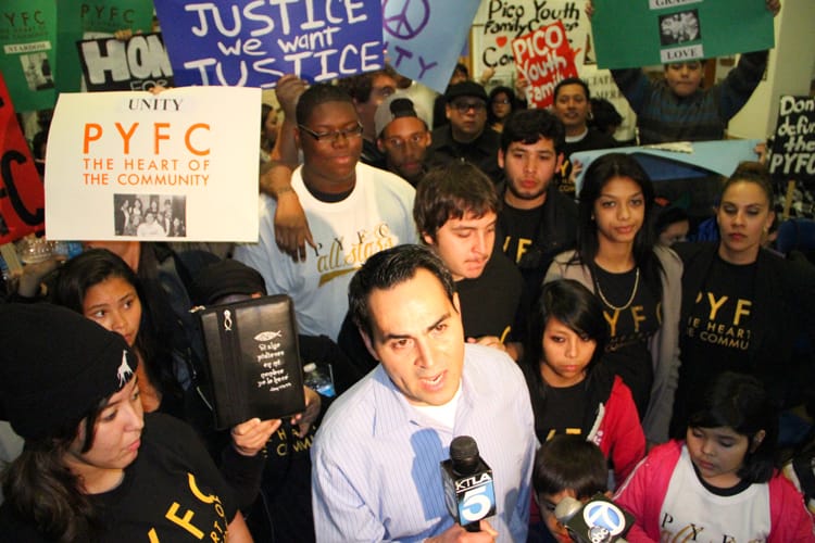 Pico Youth & Family Center founder Oscar de la Torre speaks to newscrews earlier this year before asking the City Council to continue funding for the embattled center. (File photo)