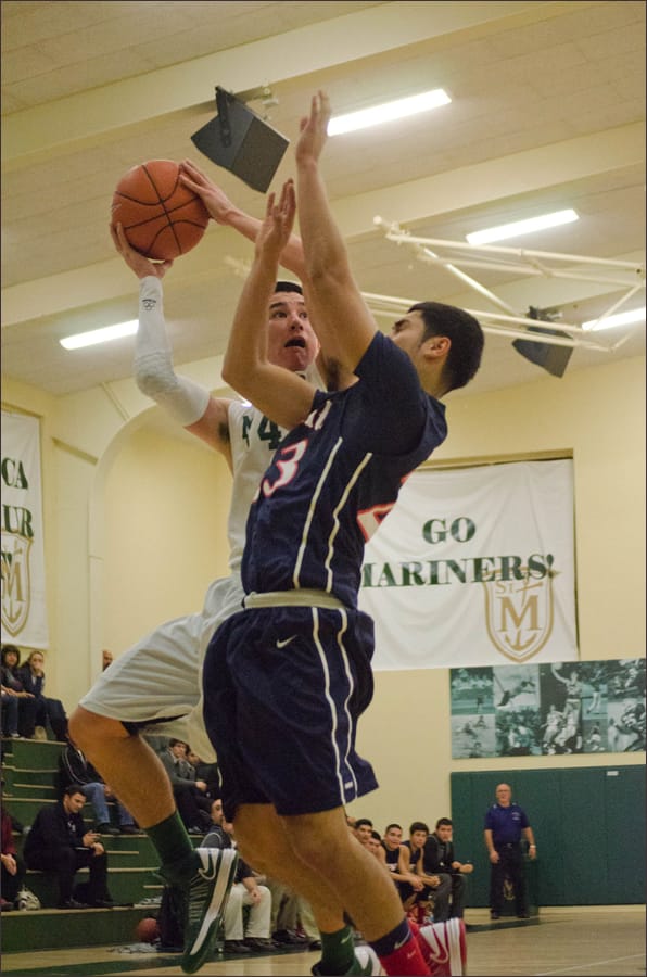 St. Monica's Jack Matsunaga goes up for a lay up against St. Paul on Wednesday. (Photo by Paul Alvarez Jr.) 