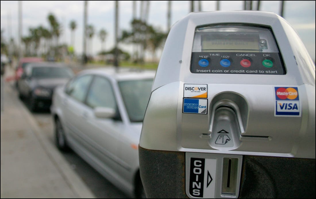 Smart parking meters line Barnard Way near the beach.