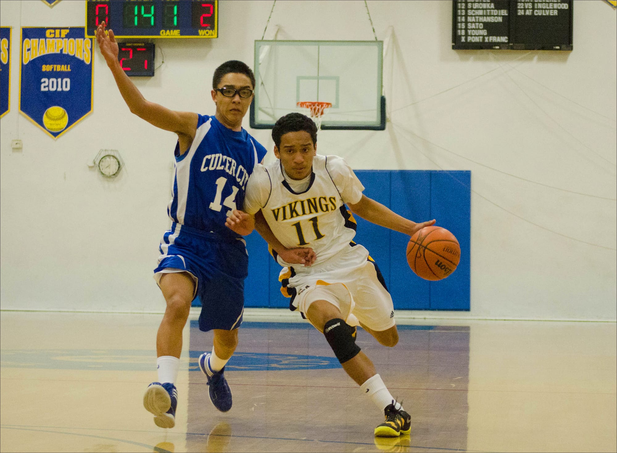 BLOWING BY: Samohi's Trevis Jackson runs past Owen Furuta of Culver City on Friday at home. Samohi would go on to win, 78-52. (Photo by Paul Alvarez Jr.)
