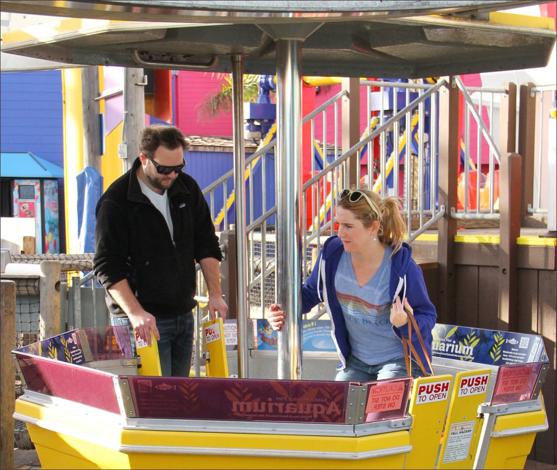 HOP ON: A couple boards one of the gondolas on the Pacific Park Ferris wheel on Monday. (Photo by Daniel Archuleta)