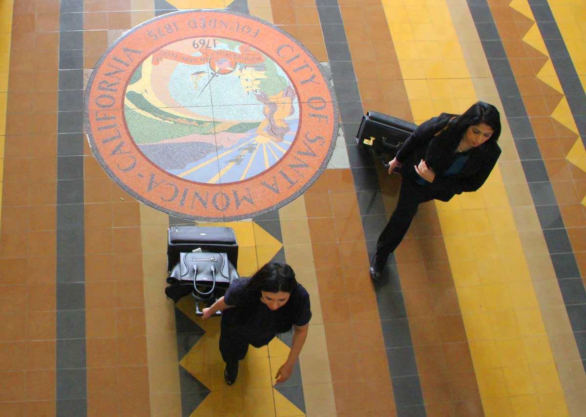 THE SPOT: People walk across the lobby of Santa Monica City Hall on Tuesday. City officials warn that budget shortfalls may be on the horizon. (Daniel Archuleta daniela@www.smdp.com)