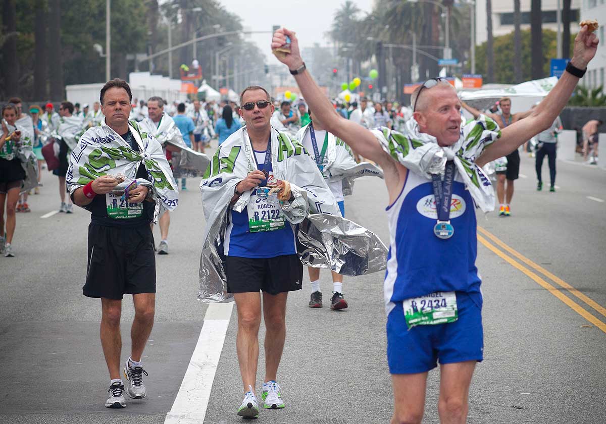 DONE: Runners celebrate after finishing last year's LA Marathon. (Brandon Wise brandonw@www.smdp.com)