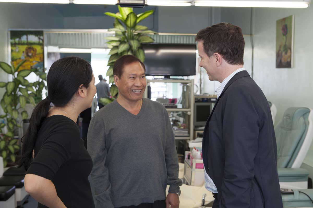 Mayor Pro Tem Terry O'Day (right) talks shop with nail salon owner Chau Nguyen of Nancy's Nails who took the pledge to create a safer, healthier work environment. He's been in the nail salon business for 28 years. (Photo courtesy Thuan Nguyen)