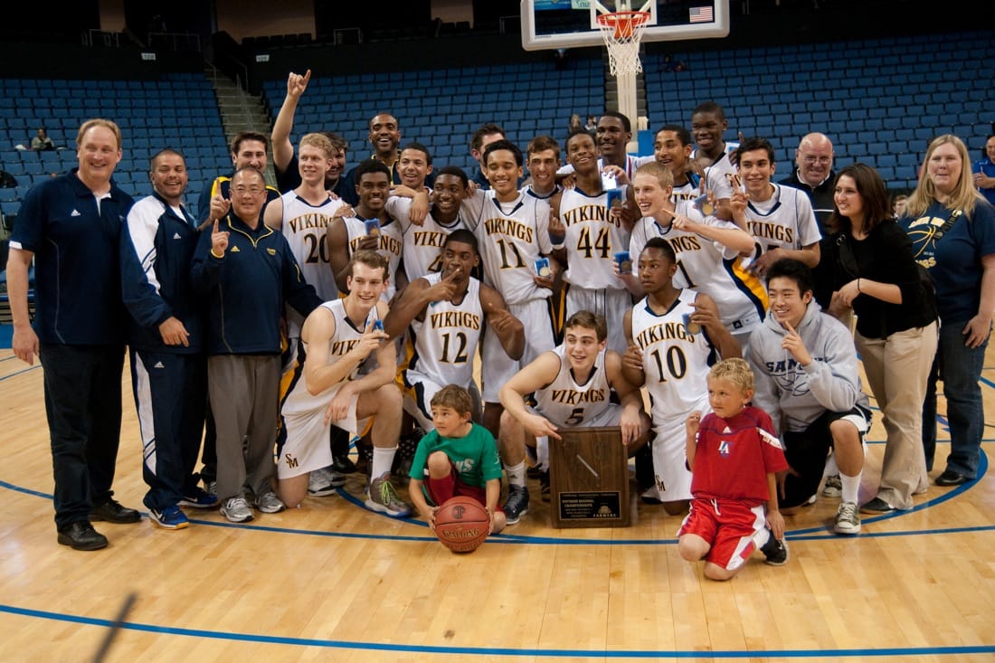 Samohi's boys' basketball team celebrates after winning the SoCal regional final of the CIF-State Boys Basketball Division I Championship on Saturday in Ontario, Calif. (Photo by Morgan Genser)