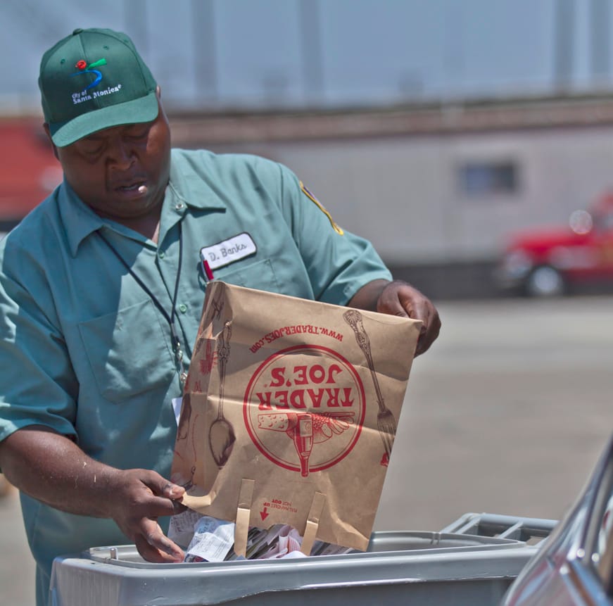 THERE IT GOES: Derwin Banks of Santa Monica's Resource Recovery and Recycling service helps locals shred documents and recycle old electronics at the City Yard last year. (File photo)