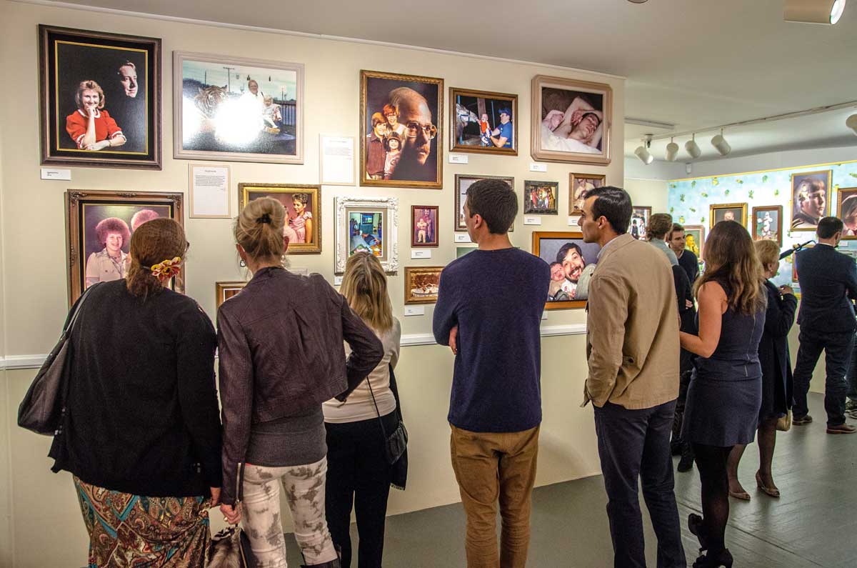 Guests look at Awkward Family Photos on Thursday, March 27. (Fabian Lewkowicz FabianLewkowicz.com)