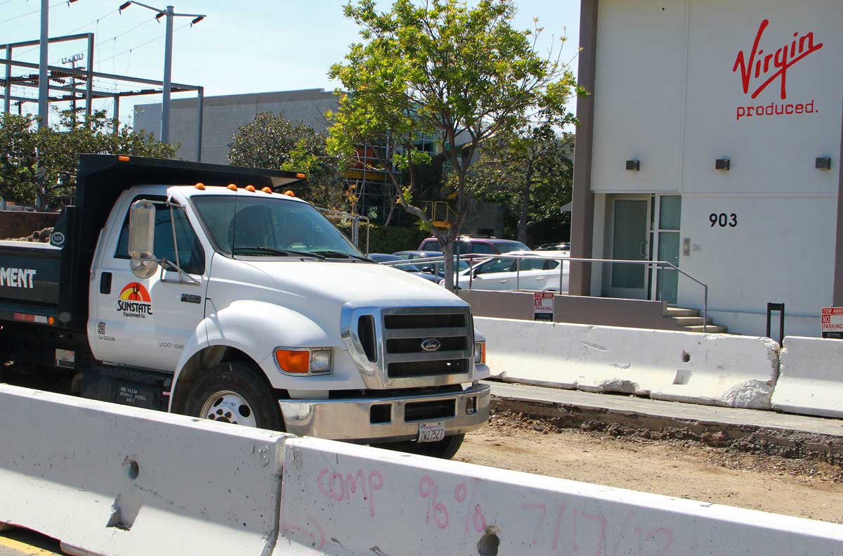 WORKING IT: Virgin Produced is among the businesses impacted by noise related to construction of the Expo Light Rail Line along Colorado Avenue. So far, they say it isn't a bother. (Daniel Archuleta daniela@www.smdp.com)