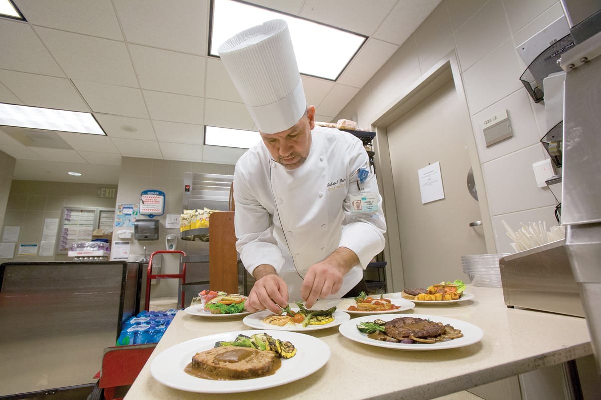 Gabriel Gomez, executive chef, prepares antibiotic-free menu items at Ronald Reagan UCLA Medical Center.