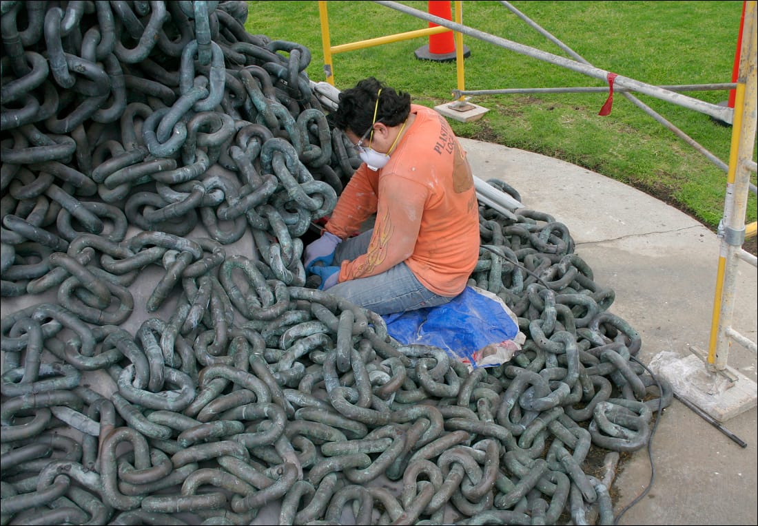 A worker inspects 'Chain Reaction' last year. (File photo)