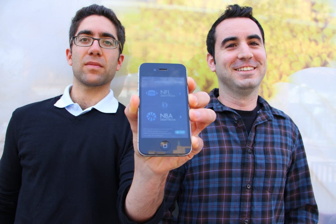 HIGH TECH: Joe Sarafian and David Rabie show off their Draftpedia app for the iPhone. (Photo by Daniel Archuleta)