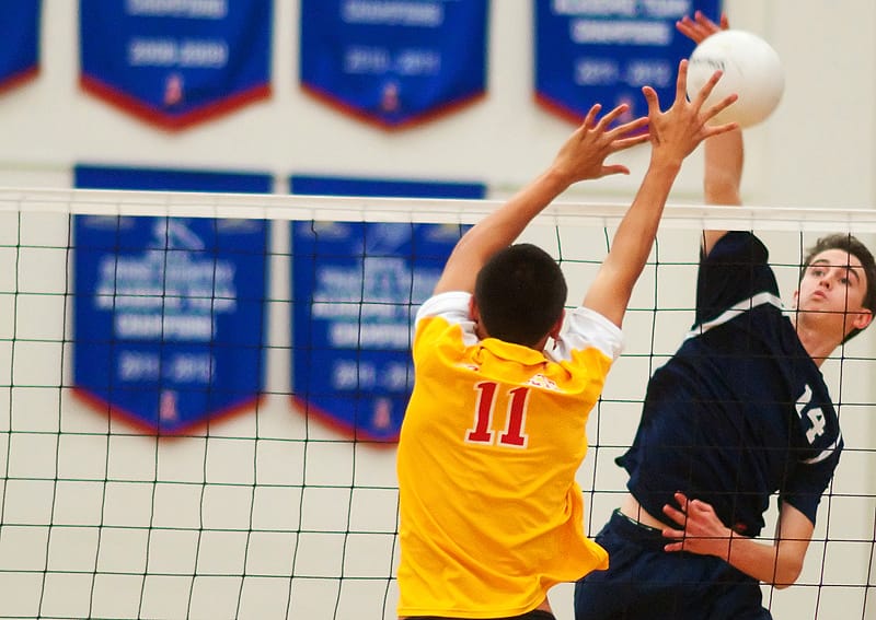 Crossroads' Nick Graves spikes the ball against Paraclete earlier this season. (Photo by Morgan Genser)