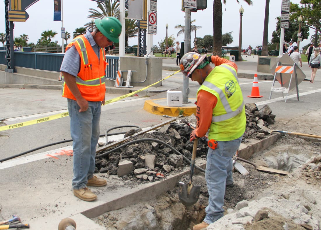 A small crew works on bringing water to the future site of Tongva Park. The park, located across Ocean Avenue from the enterance to the Santa Monica Pier, is slated to be completed later this year. (File photo)