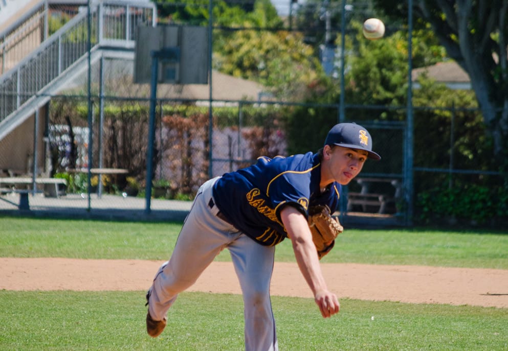 Santa Monica's River Moore delivers a pitch against rival Venice earlier this season. (Paul Alvarez)