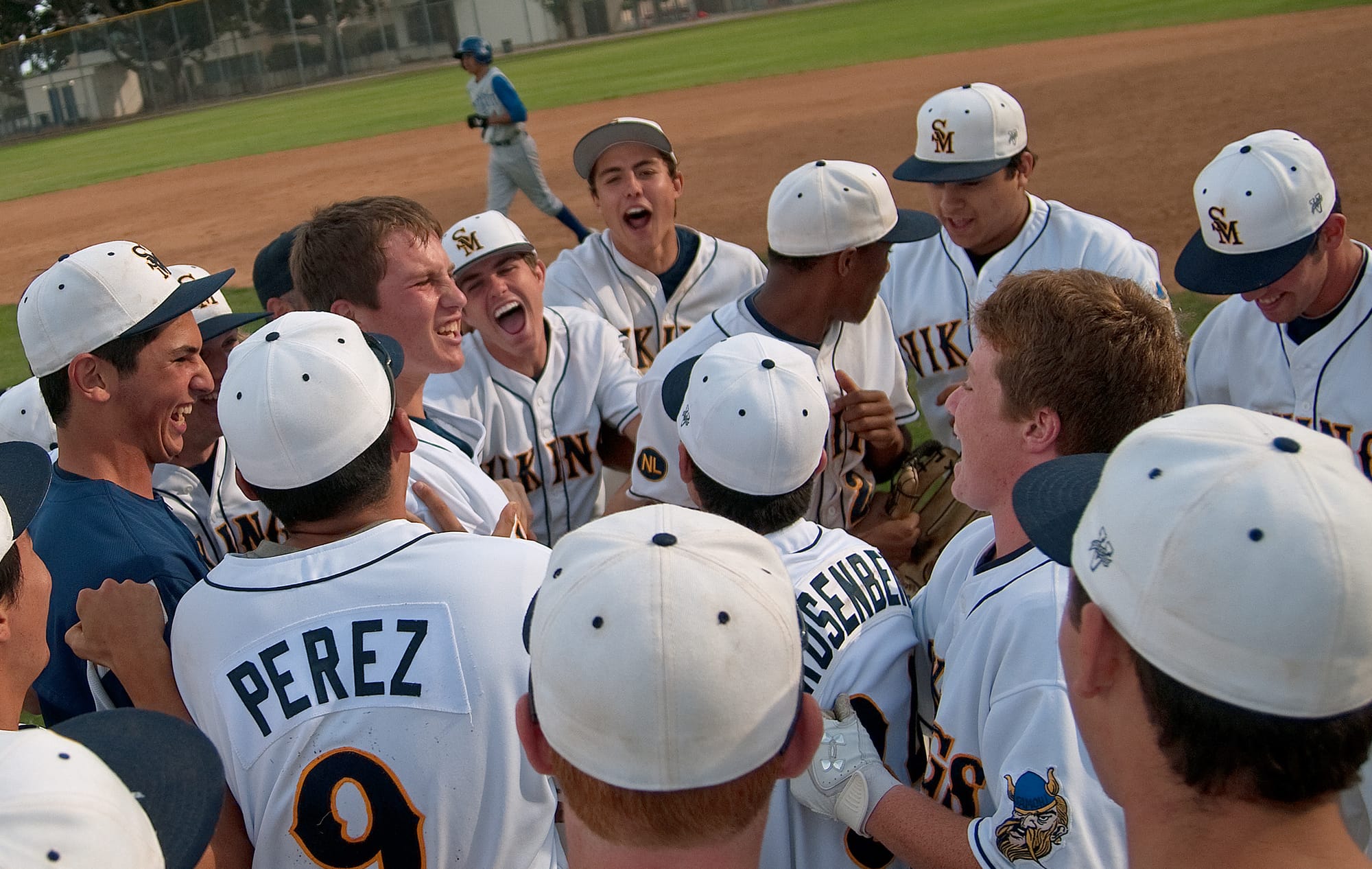 Samohi players celebrate after beating Culver City on Thursday at home. (Photo by Morgan Genser)