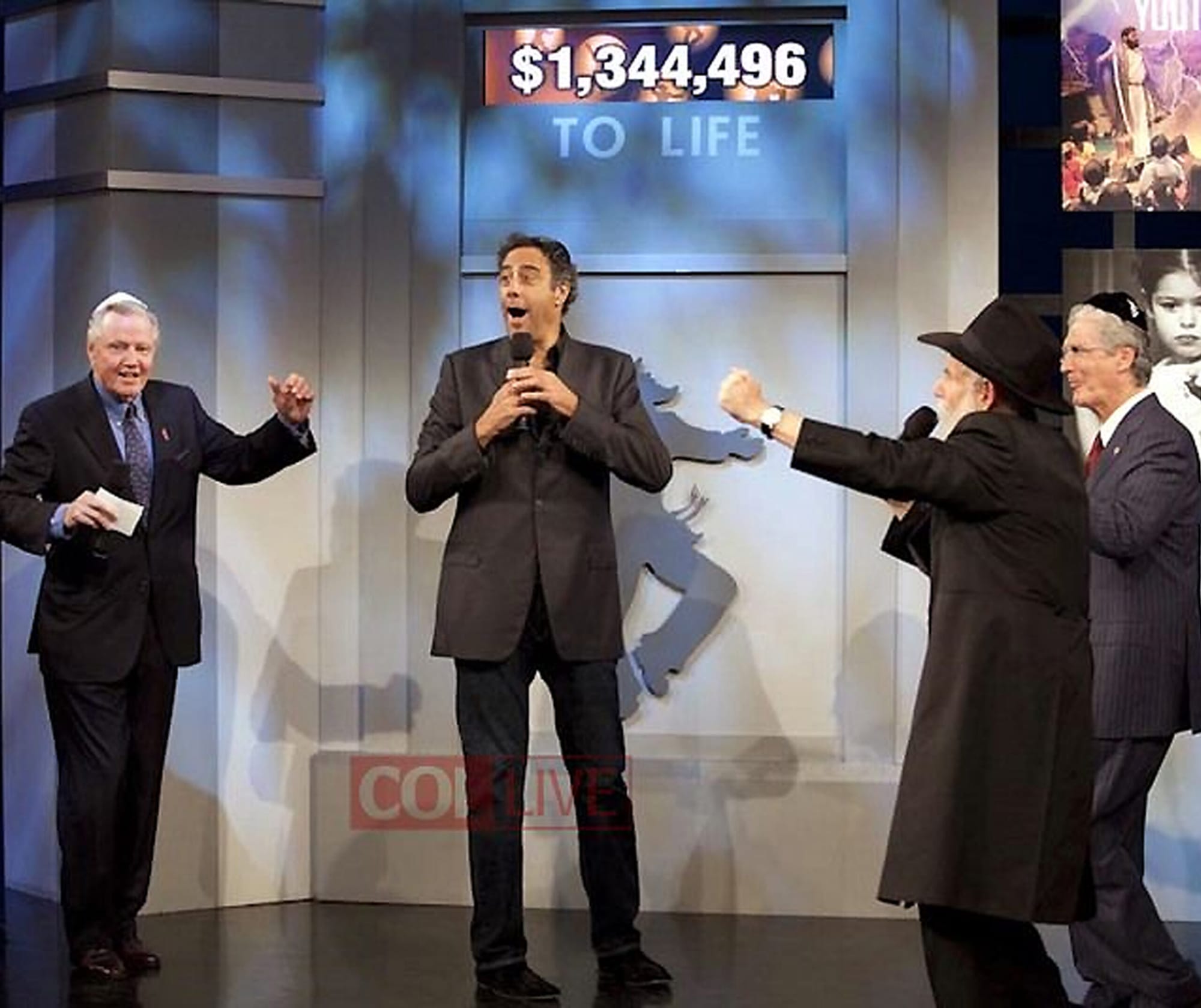KICKING IT: Jon Voight (left) celebrates during a recent Chabad Telethon. (Photo courtesy Chabad)