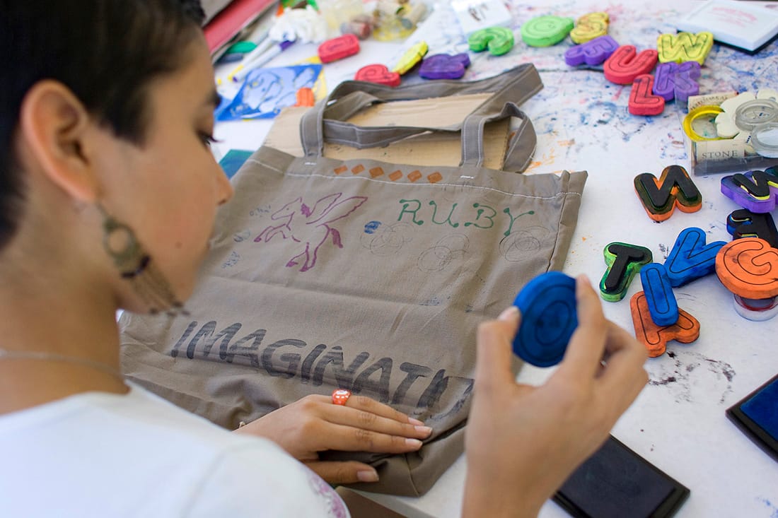 CRAFTY: Ruby Resenbiz creates a tote bag at the Santa Monica Festival in 2010. (File photo)