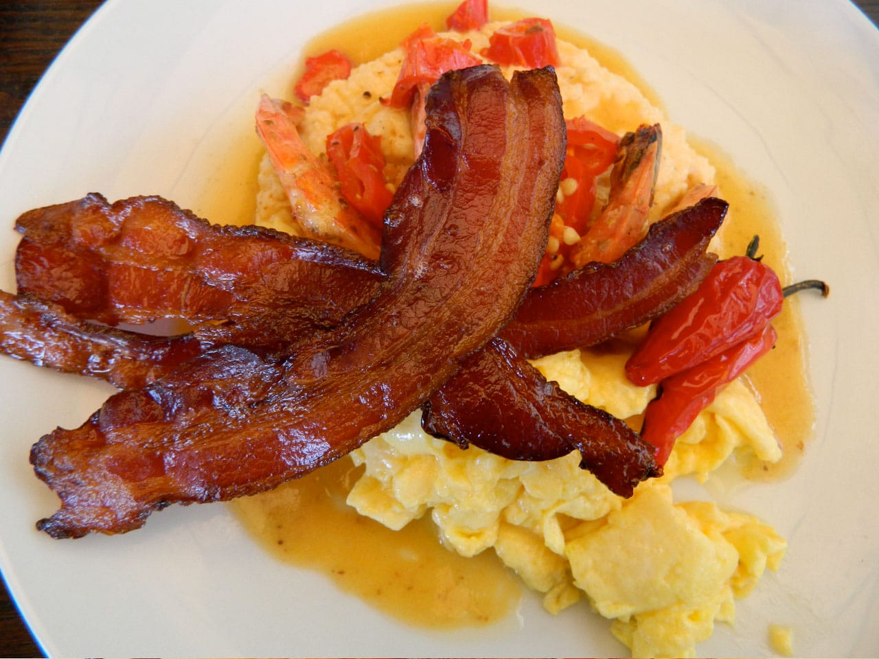 The shrimp grits with Fresno chili peppers, applewood-smoked bacon and scrambled eggs. (Photo courtesy John Blanchette)