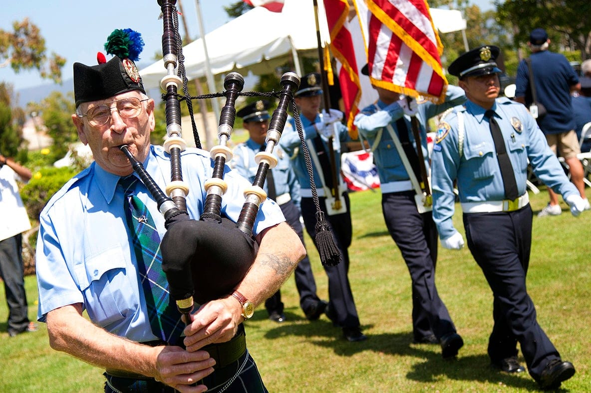 Highland bagpiper Thomas Allan plays during Woodlawn Cemetery's annual Memorial Day service. (Photo by Brandon Wise)