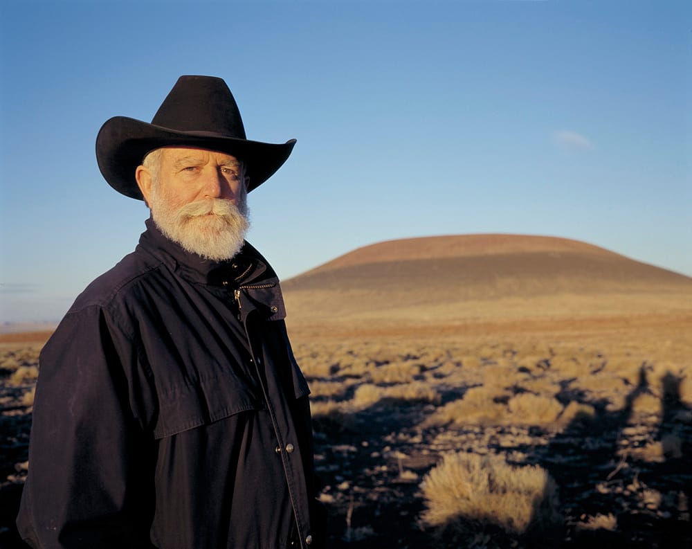 Artist James Turrell in front of his Roden Crater Project at sunset in October, 2001. (Photo courtesy Florian Holzherr/Los Angeles County Museum of Art )