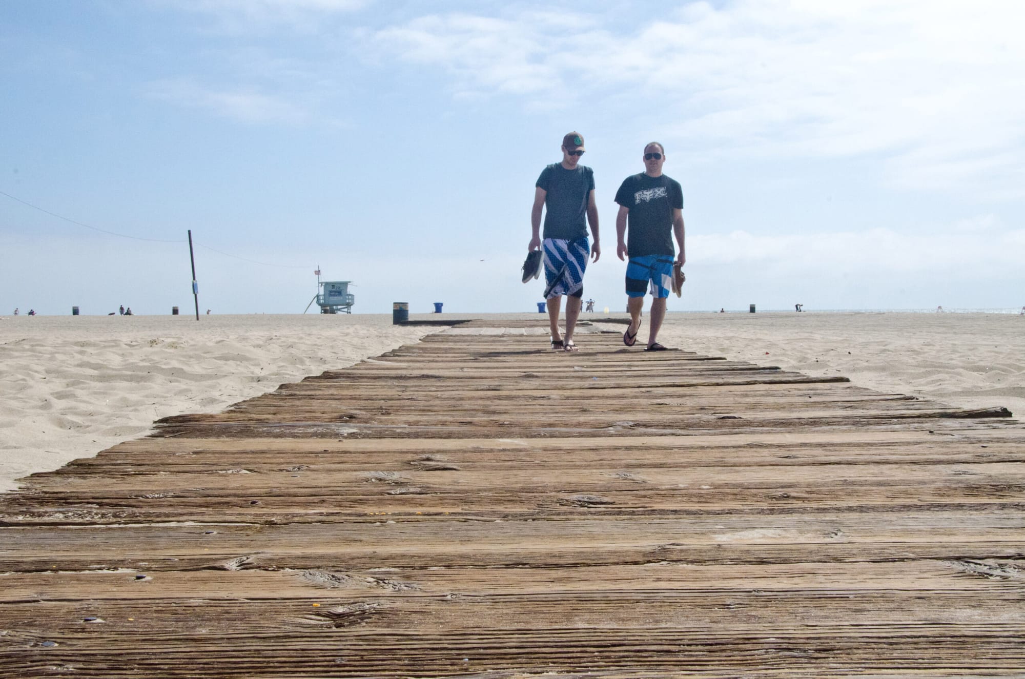 Two people walk on the Bay Street Plank Walk on Wednesday. City Hall plans to extend walkways like this one to make it easier for people with disabilities to access the beach. (Photo by Fabian Lewkowicz FabianLewkowicz.com)