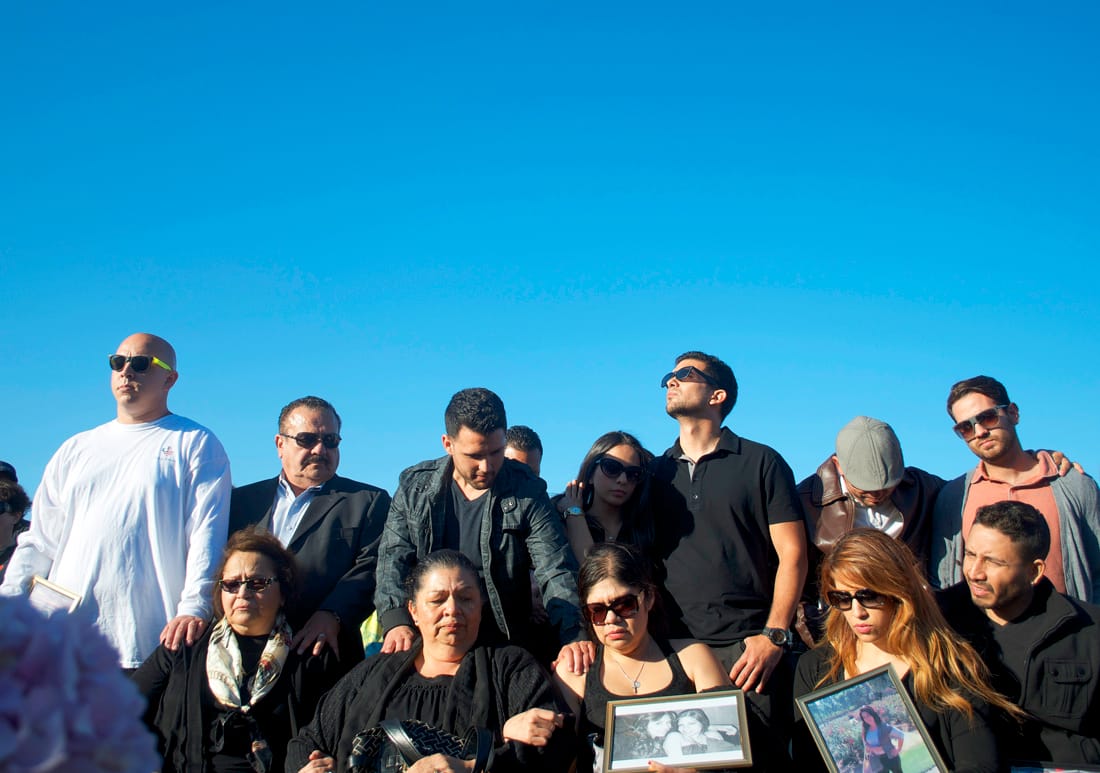 People take part in a vigil Monday at Santa Monica College to remember the five victims who died as part of shooting rampage that shocked the community last Friday. (Photo by Paul Alvarez Jr.)