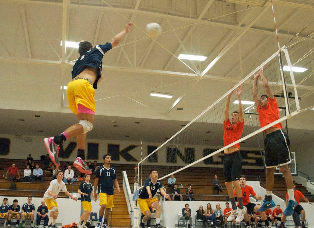 Santa Monica's Dane Keckin spikes a ball against Beverly Hills earlier this season. (File photo)