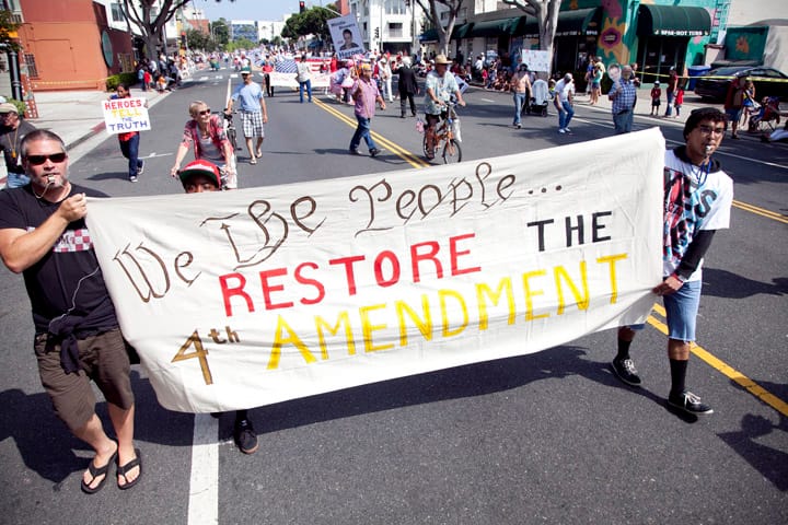 Members of the Restore the Fourth movement march along Main Street Thursday as part of the annual Fourth of July parade. (Brandon Wise brandonw@www.smdp.com)