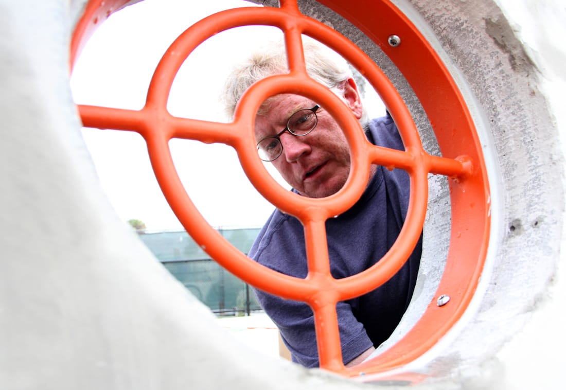 A work crew was busy putting the final touches on a new universally accessible playground on Wednesday. (Photo by Daniel Archuleta)