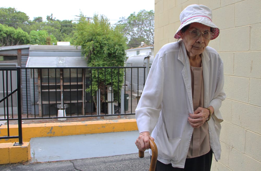 Resident Maria C. Viesca takes a stroll around Village Trailer Park on Thursday. She has lived there for 24 years. The Rent Control Board Thursday begrudgingly voted to allow the park to close. (Daniel Archuleta daniela@www.smdp.com)