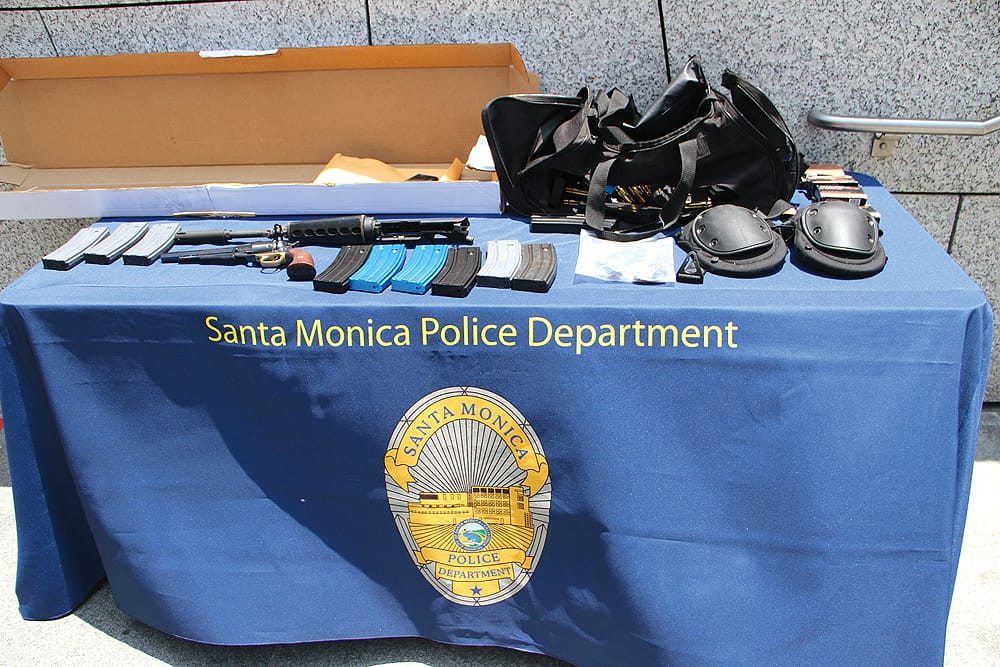 Weapons, ammunition and ammo clips found in a black bag carried by John Zawahri during a shooting rampage were put on display for reporters by the Santa Monica Police Department in June. (File photo)