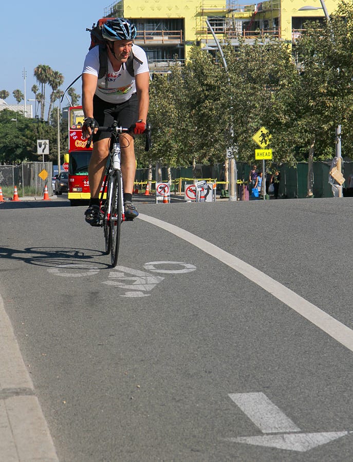 A cyclist makes his way down Main Street on Monday during the evening commute. (Photo by Daniel Archuleta)