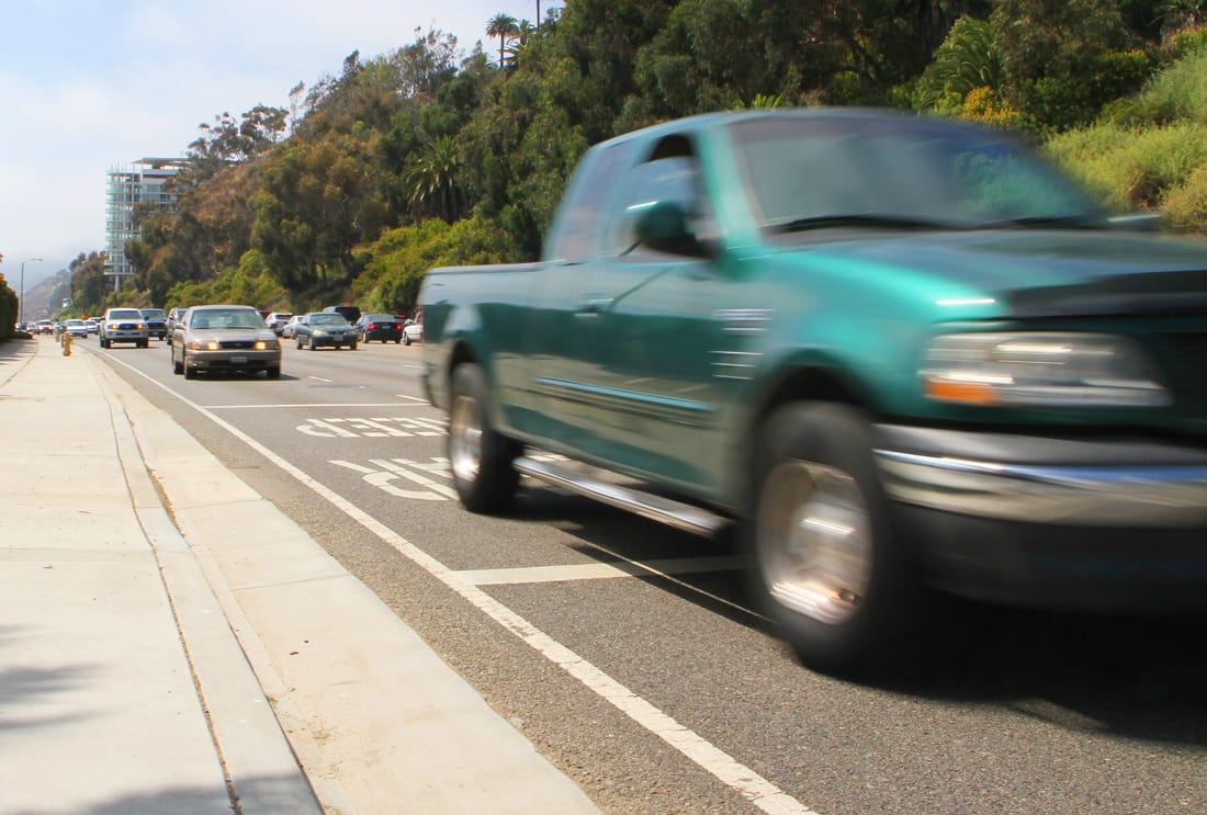 Cars streak past the Annenberg Community Beach House on Pacific Coast Highway on Monday. (Photo by Daniel Archuleta)