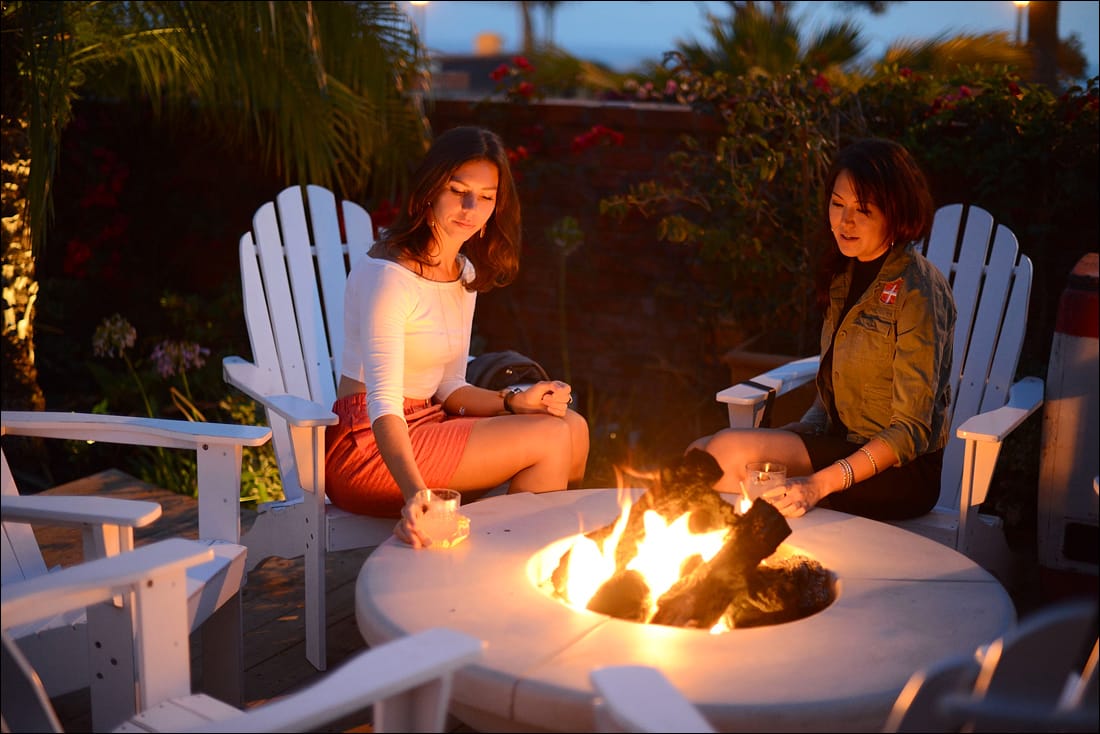 Two young ladies enjoy a drink on the back patio of The Bungalow. (File photo)