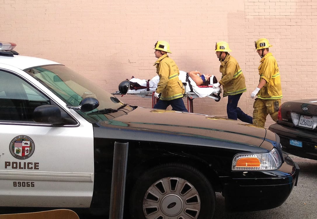 Firefighters assist one of the injured after a crash in Venice Beach in August of last year. (Byron Kennerly)