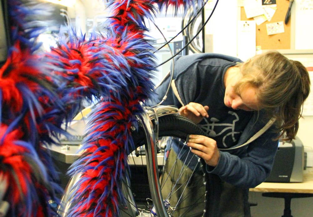 Mechanic Emily Sullivan works on a rather furry bike at the Santa Monica Bike Center on Thursday. (Daniel Archuleta daniela@www.smdp.com)