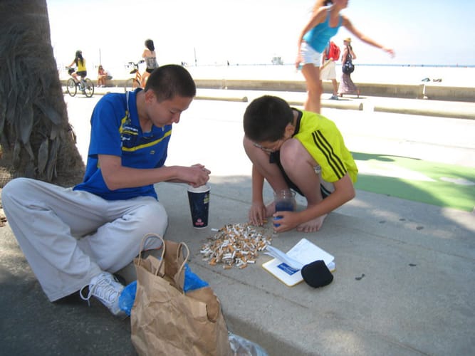 YUCK: A cigarette butt research team collects data along the beach boardwalk. (Photo courtesy Benjamin Kay)
