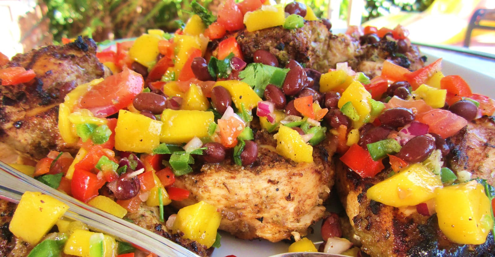 Jerk chicken with mango salsa. (Photo courtesy repurposedlife.wordpress.com)