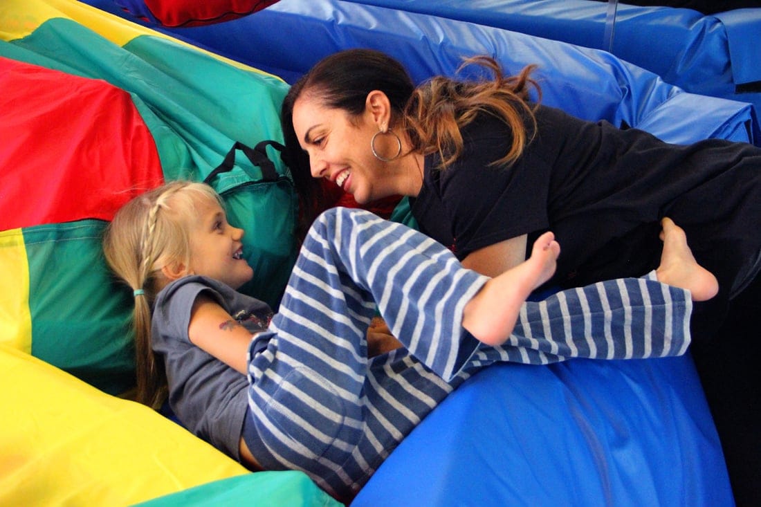 We Rock the Spectrum Santa Monica owner Debra Davis plays with Finley Rossi on Monday. (Daniel Archuleta daniela@www.smdp.com)