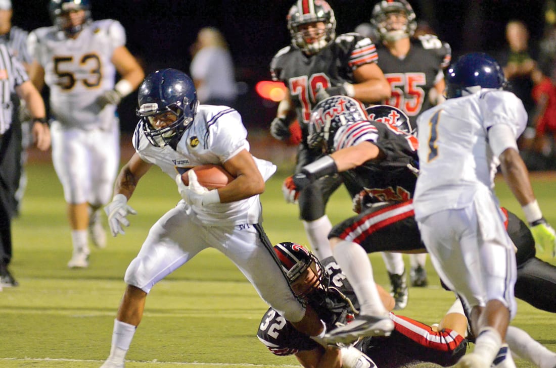 Samohi's Tramaine Taylor runs for a gain against Hart last season. (File photo)