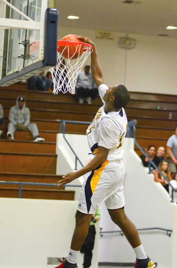 hops: Samohi's Jordan Mathews slam dunks the ball during last year's Santa Monica Tournament. Mathews has since moved on to Cal. (File photo)