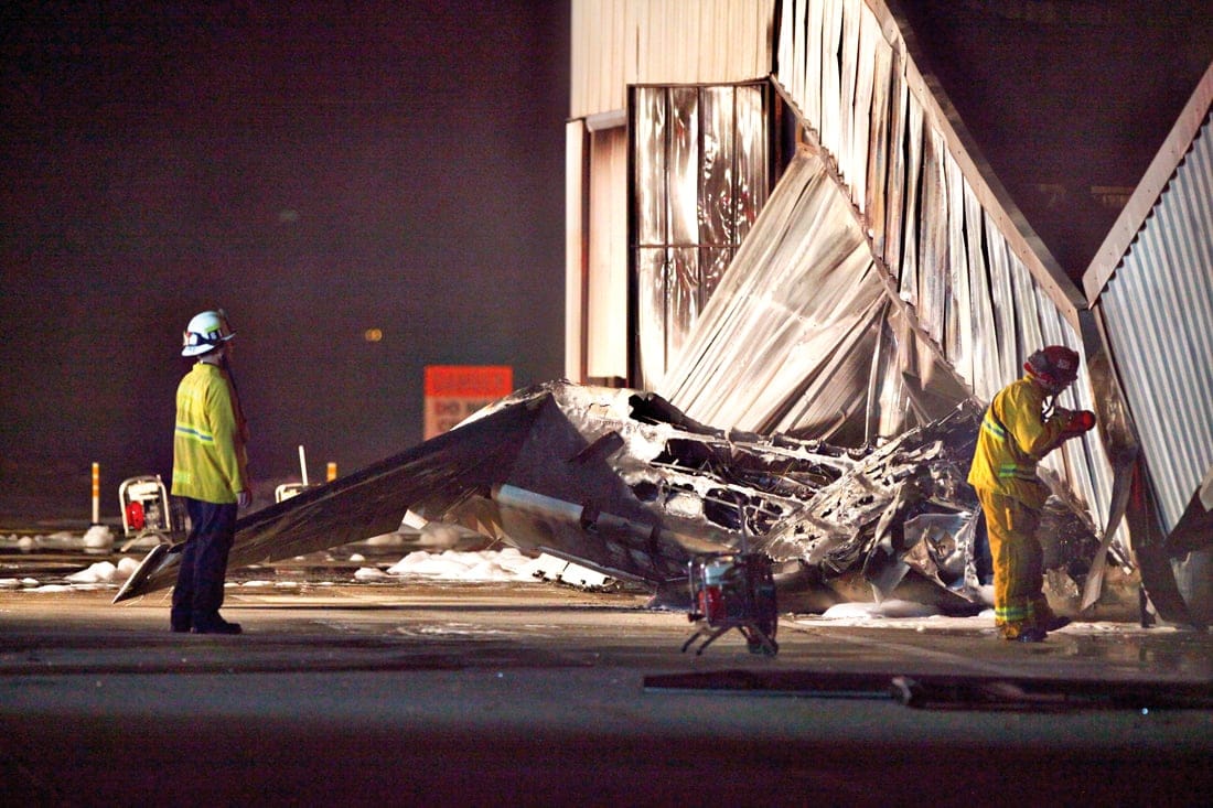 THE SCENE: Firefighters survey the crash site at Santa Monica Airport in September. (Photo courtesy David J. Hawkins)