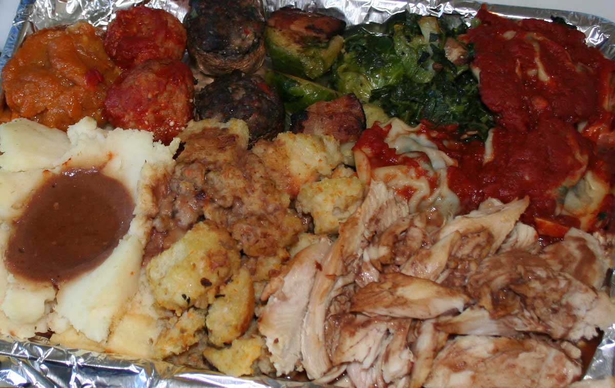 Leftovers from a Thanksgiving feast get ready to be incorporated into a stuffed sandwich. 