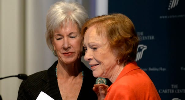 Former First Lady Rosalynn Carter, right, thanks Department of Health and Human Services Secretary Kathleen Sebelius, after Sebelius announced easier access to mental health care during the 29th annual mental health policy symposium at the Carter Center on Friday, Nov. 8, 2013, in Atlanta. (AP Photo/David Tulis)