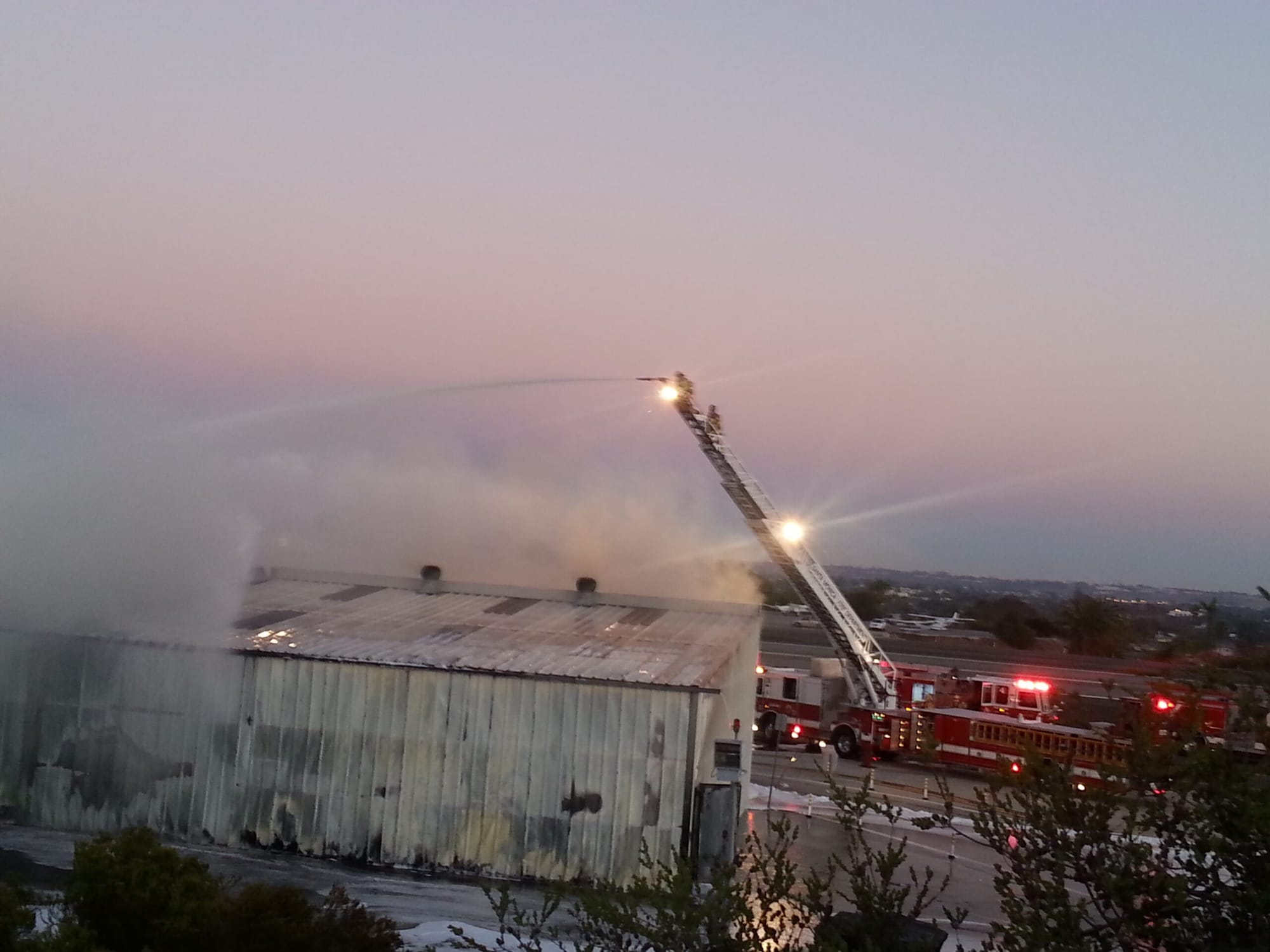 Fire fighters work to extinguish the blaze at SMO Sunday night. (Photo courtesy Ron Casa)