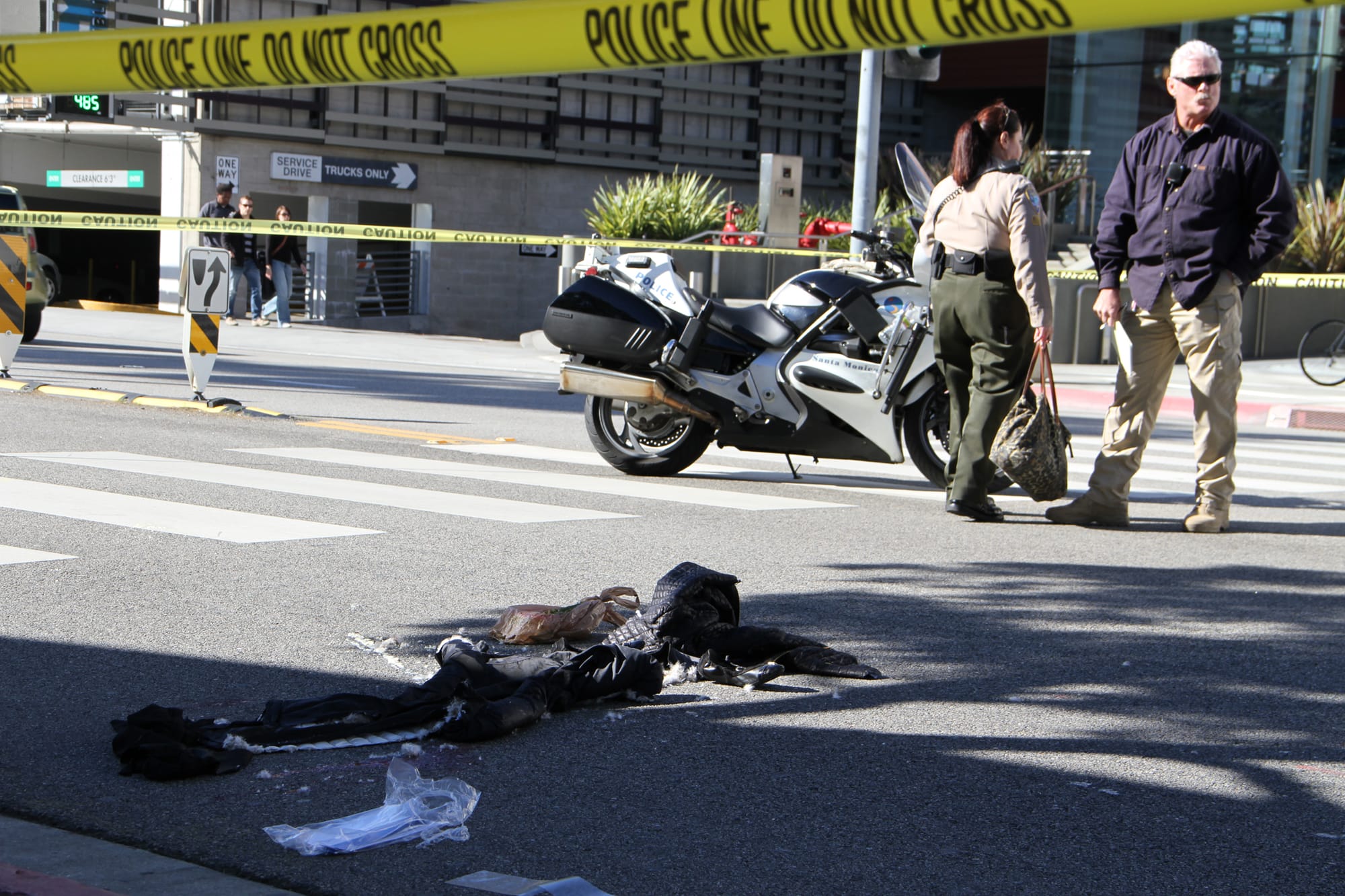 Police investigate a collision Wednesday involving a pedestrian who was hit by a car while crossing Colorado Avenue near Santa Monica Place mall. (Photo by Kevin Herrera)