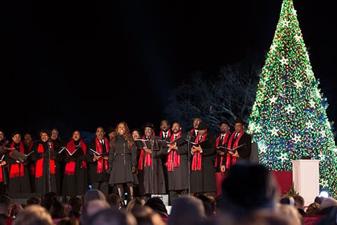 A choir sings at  the 91st annual National Christmas Tree Lighting held earlier this month. President Obama was invited to light the National Christmas Tree and bring a message of peace to the nation and world. (photo courtesy www.recreation.gov)
