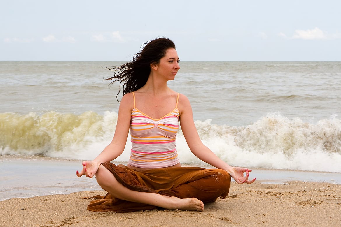girl meditation in the beach